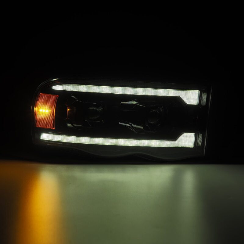 Load image into Gallery viewer, AlphaRex 02-05 Dodge Ram 1500 LUXX LED Proj Headlights Alpha Black w/Activ Light/Seq Signal

