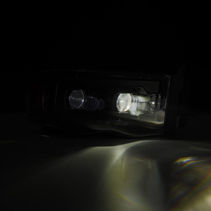 Load image into Gallery viewer, AlphaRex 02-05 Dodge Ram 1500 LUXX LED Proj Headlights Alpha Black w/Activ Light/Seq Signal
