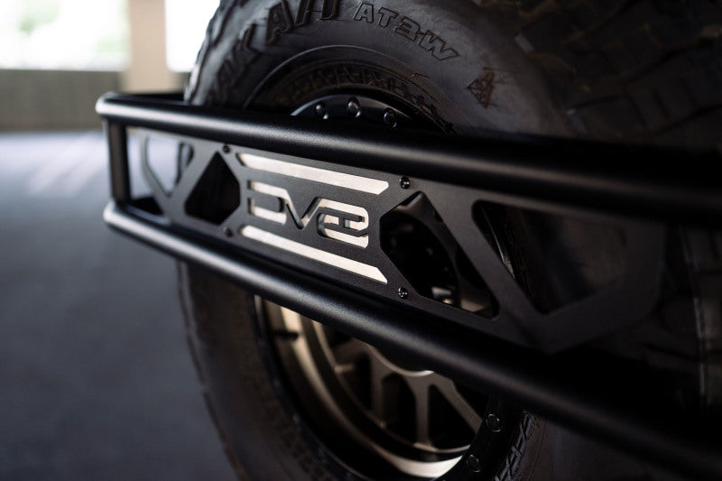 Load image into Gallery viewer, DV8 Offroad 21-23 Ford Bronco Spare Tire Guard &amp; Accessory Mount
