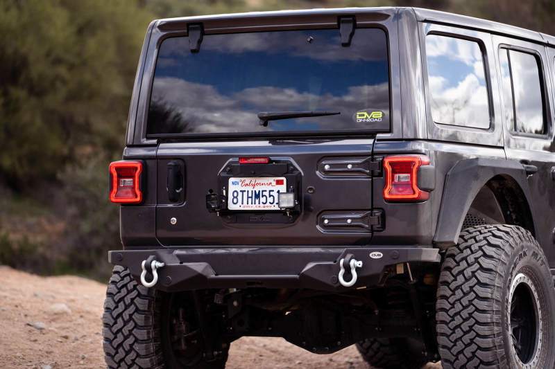 Load image into Gallery viewer, DV8 Offroad 18-22 Jeep Wrangler JL Spare Tire Delete Kit w/Light Mounts
