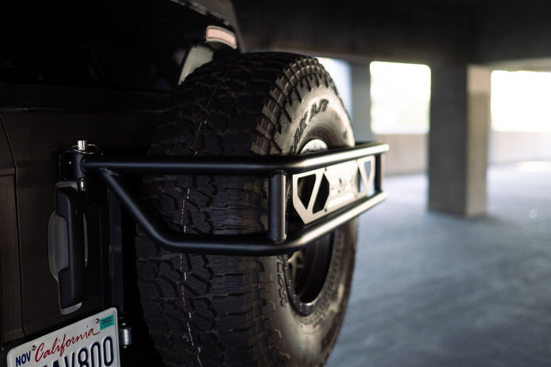 Load image into Gallery viewer, DV8 Offroad 21-23 Ford Bronco Spare Tire Guard &amp; Accessory Mount
