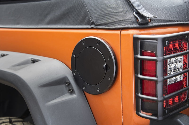 Load image into Gallery viewer, Rugged Ridge Non-Locking Gas Cap Door Black 07-18 Jeep Wrangler
