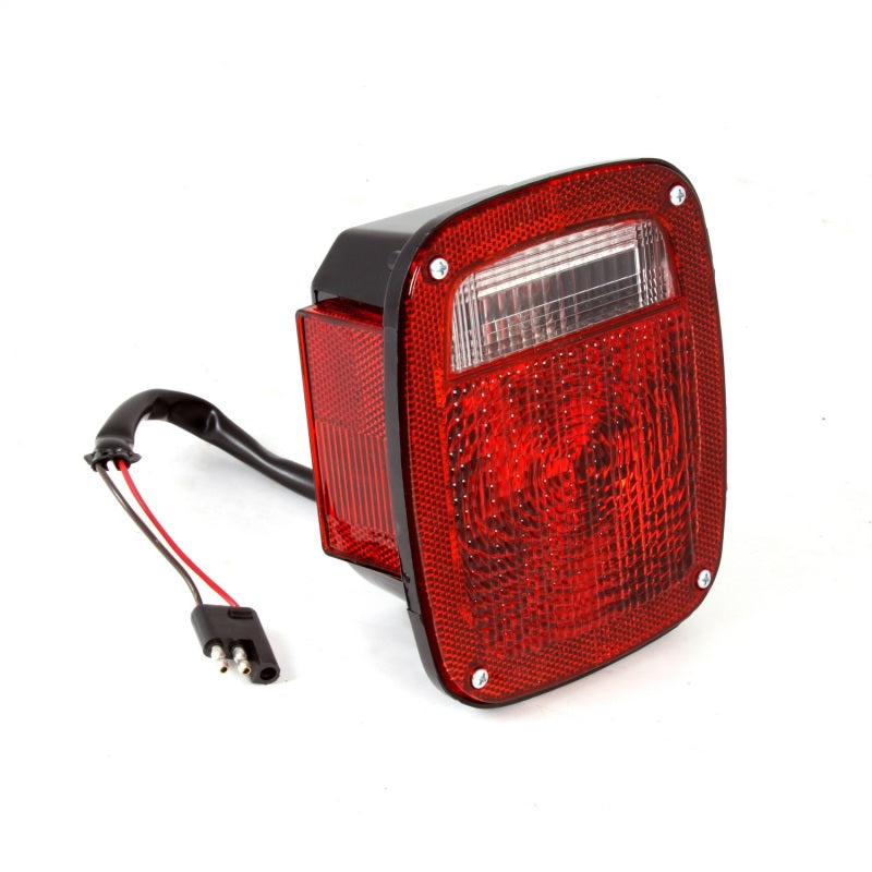 Load image into Gallery viewer, Omix Left Black Tail Lamp 81-86 Jeep CJ Models
