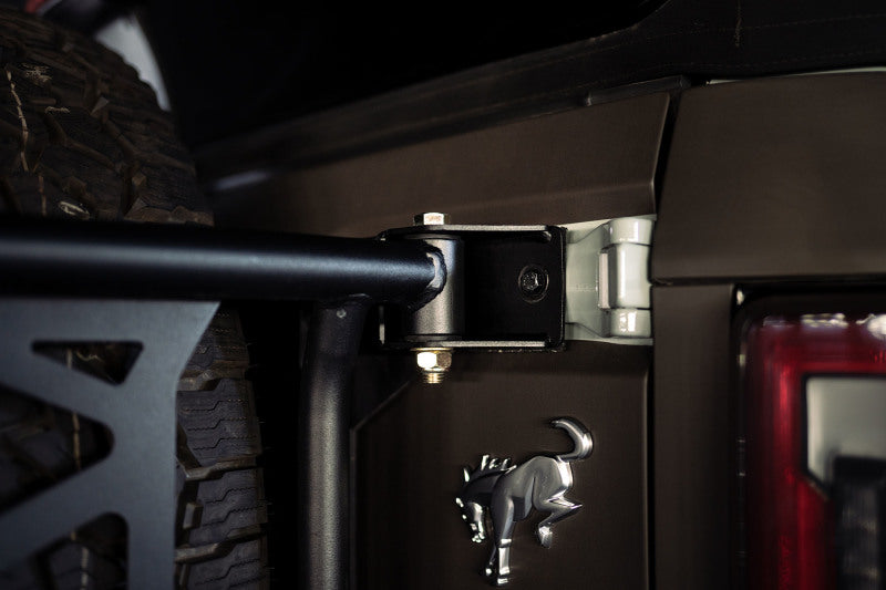 Load image into Gallery viewer, DV8 Offroad 21-23 Ford Bronco Spare Tire Guard &amp; Accessory Mount

