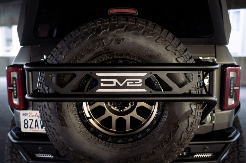 Load image into Gallery viewer, DV8 Offroad 21-23 Ford Bronco Spare Tire Guard &amp; Accessory Mount
