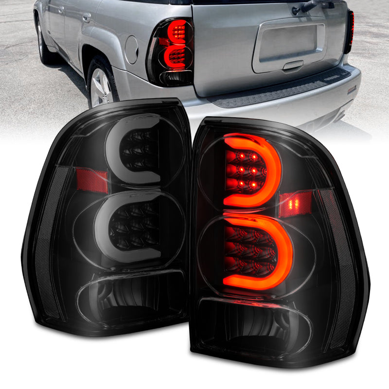 Load image into Gallery viewer, ANZO 2002-2009 Chevrolet Trailblazer LED Tail Lights w/ Light Bar Black Housing Smoke Lens
