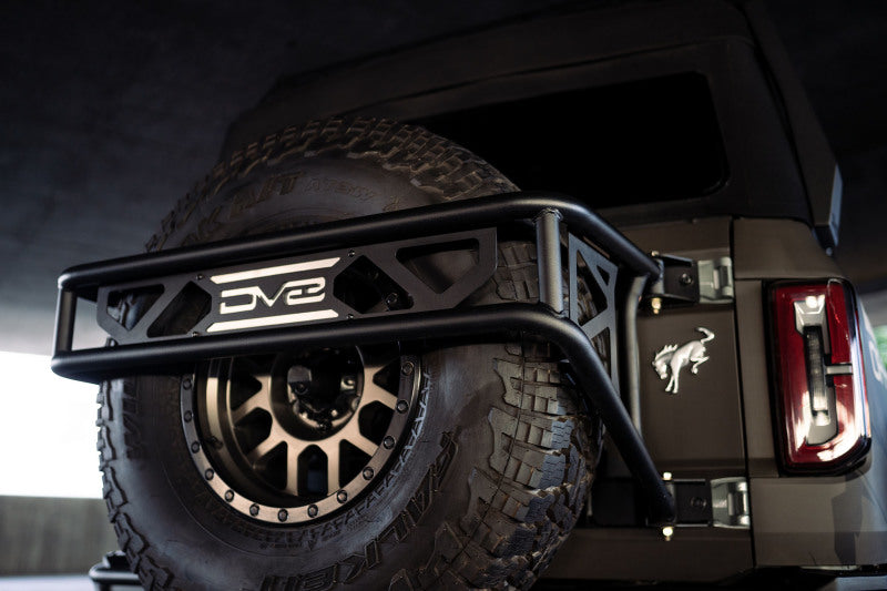 Load image into Gallery viewer, DV8 Offroad 21-23 Ford Bronco Spare Tire Guard &amp; Accessory Mount

