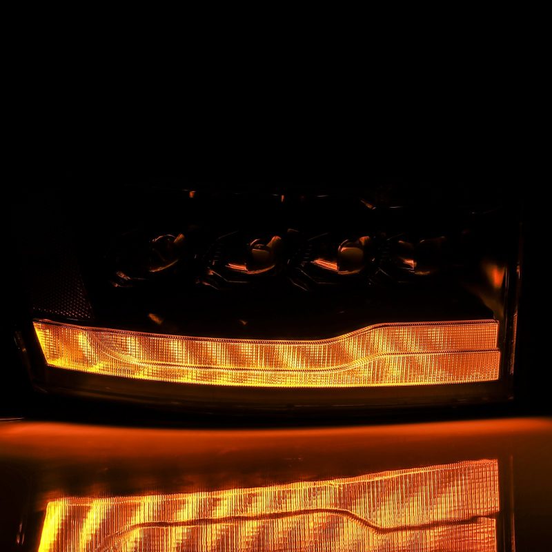 Load image into Gallery viewer, AlphaRex 06-08 Ram 1500HD NOVA LED Proj Headlights Plnk Style Alpha Blk w/Seq Signal/DRL/Amber LED
